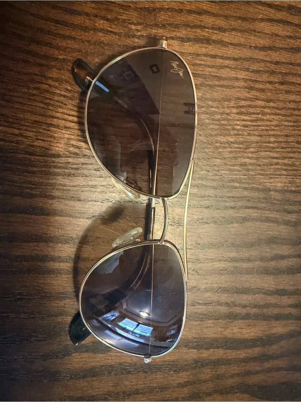 Maui Jim Aviator Sunglasses with Gold Frame and Dark Lenses and case.